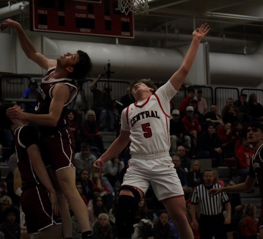 Jace Davis, junior, goes up for a rebound during tournament play during the James Johnson Winter Showcase basketball tournament.